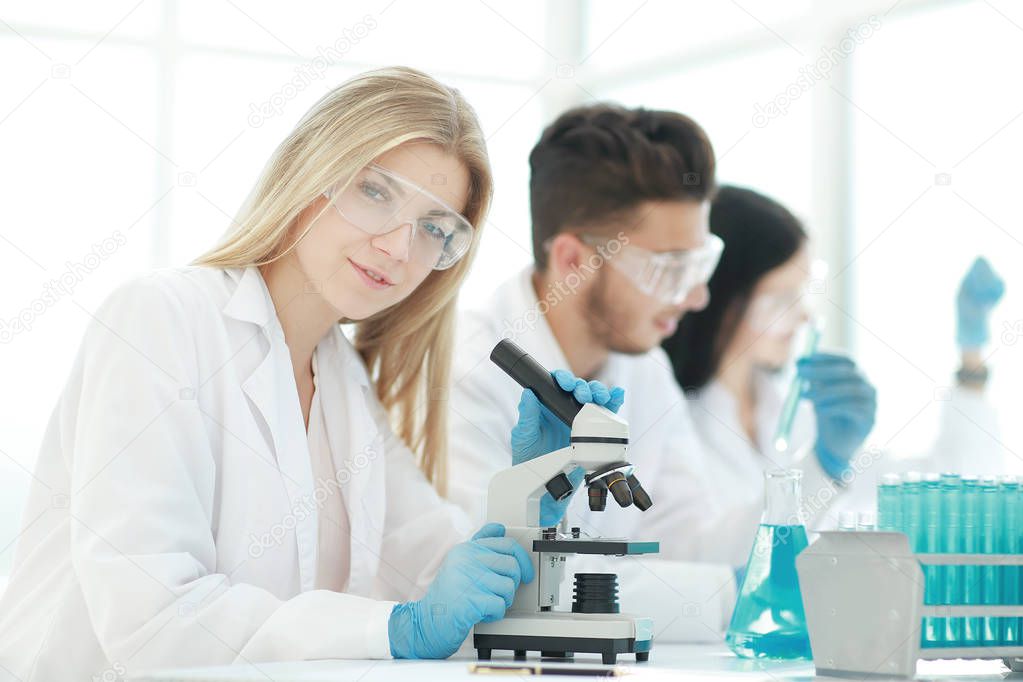 close up.female scientist working in a modern laboratory