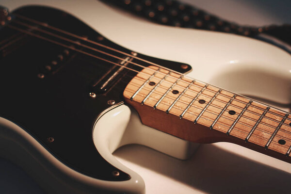 Closeup. black electric guitar on white background.