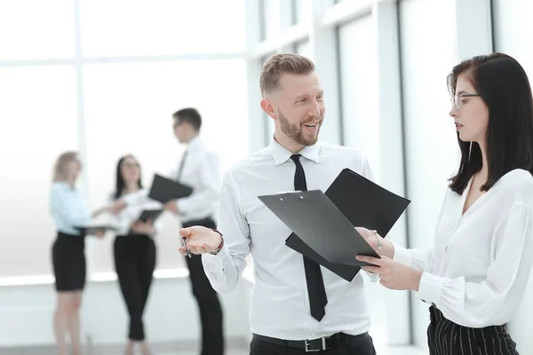 business couple read a business document together