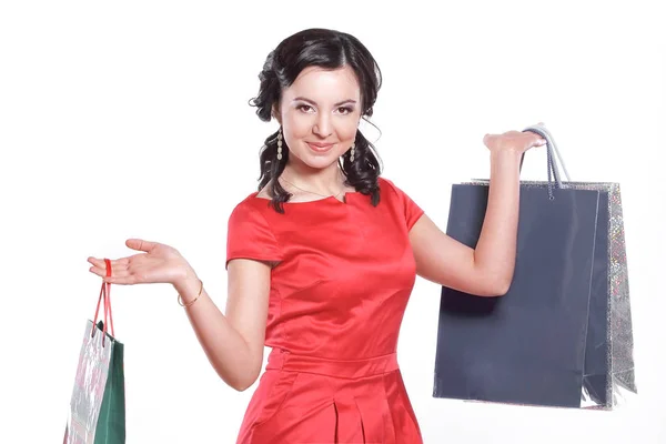 Mujer de compras sosteniendo bolsas, aislado en fondo blanco estudio — Foto de Stock