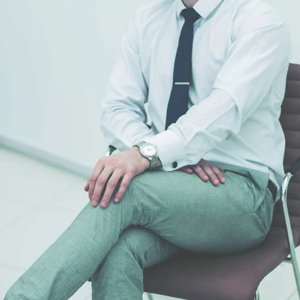 Concept of business success - businessman sitting on a chair in — Stock Photo, Image