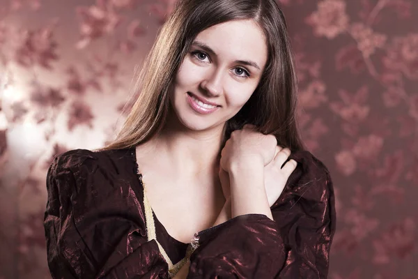 Portrait of beautiful young woman in elegant dress. — Stock Photo, Image