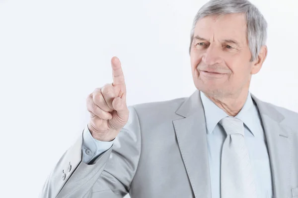 Mature businessman pointing finger to virtual point Royalty Free Stock Images