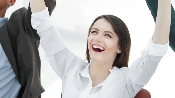 Closeup.dreaming mujer de negocios y equipo de negocios sentado en el escritorio — Foto de Stock