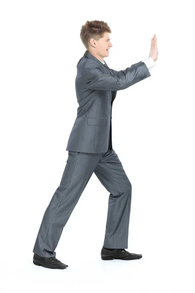 En pleno crecimiento. hombre de negocios moderno, moviendo la pared con sus manos , — Foto de Stock