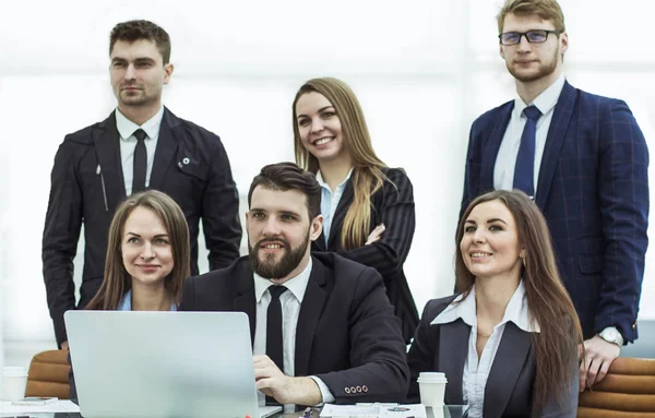 Concept of teamwork - a successful business team in the workplace in the office — Stock Photo, Image