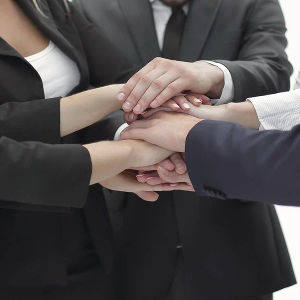 Close up.a group of business people put their hands together — Stock Photo, Image