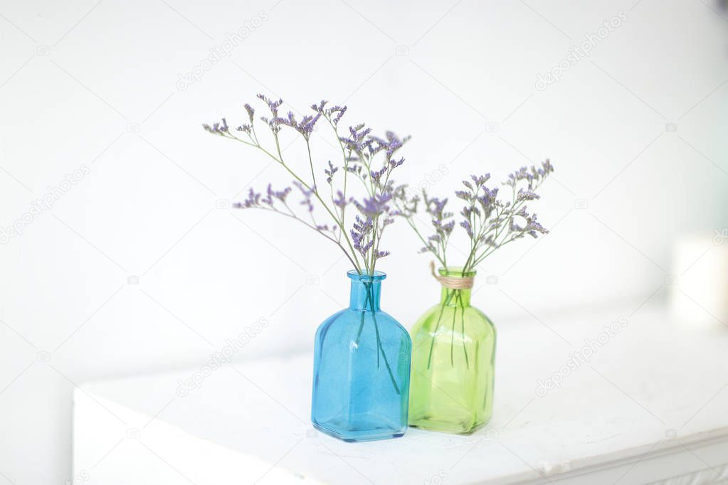 Flower decoration in glass bottles.photo with copy space