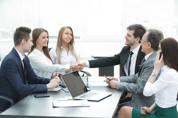 Business partners shaking hands after a successful transaction — Stock Photo, Image