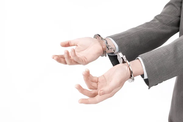 Closeup. business men holding a handcuffs. isolated on white — Stock Photo, Image