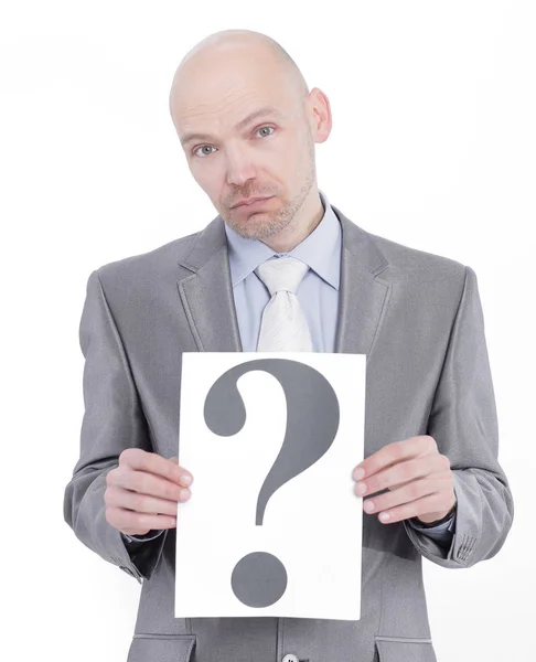 Confident businessman holding a banner with a question mark — Stock Photo, Image
