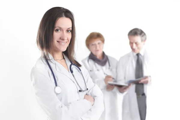 Confident female doctor therapist on blurred background of colleagues Stock Picture