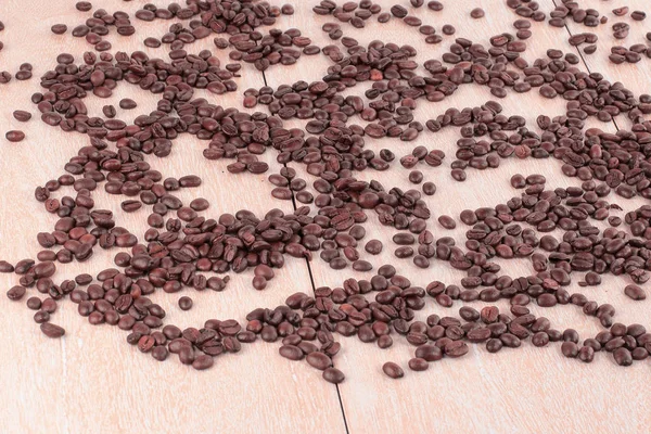 Black coffee beans on a wooden table.photo with copy space — Stock Photo, Image