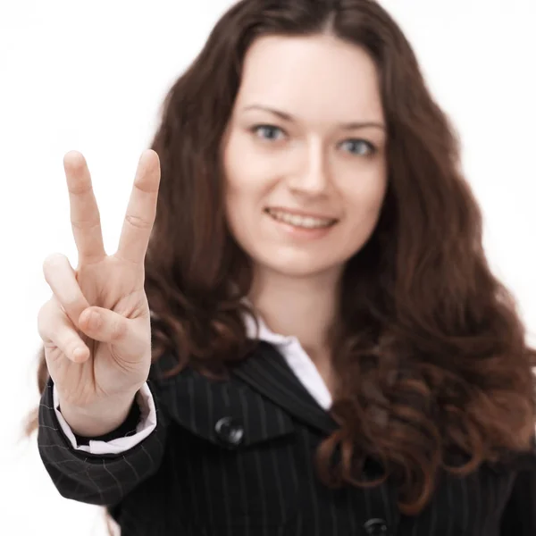 Selbstbewusste Geschäftsfrau zeigt Siegeszeichen. isoliert auf weißem Hintergrund. — Stockfoto