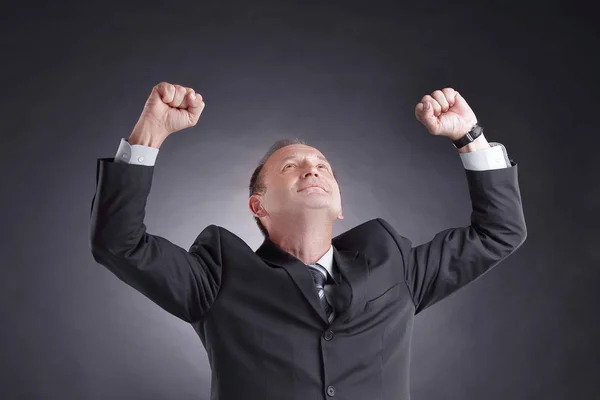 happy businessman isolated on black background. photo with copy space