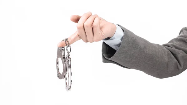 Closeup. business men holding a handcuffs. responsibility for crimes. — Stock Photo, Image