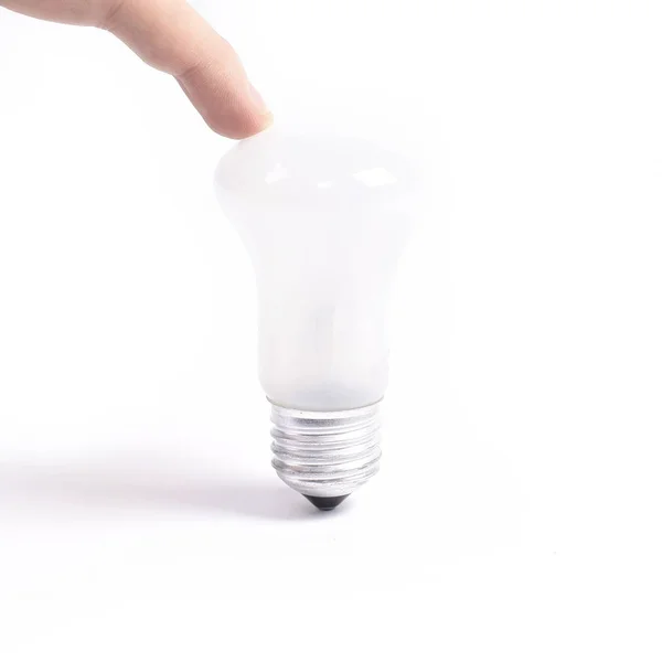 Vinger aanraken van de bulb.isolated op een witte achtergrond. — Stockfoto