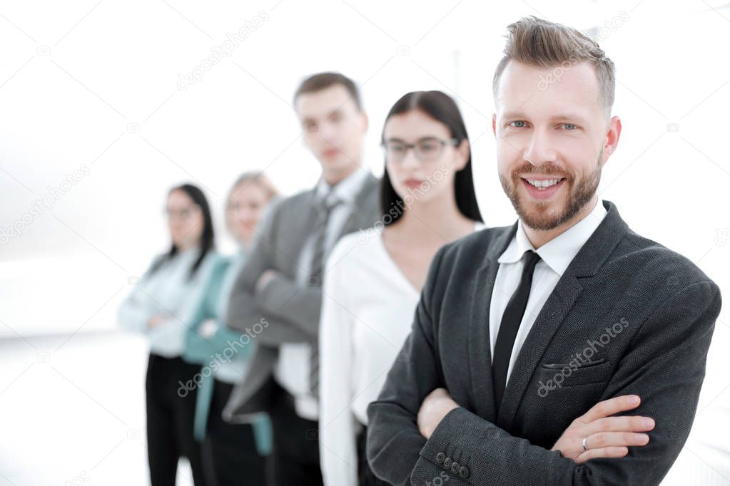 confident businessman standing in front of his business team