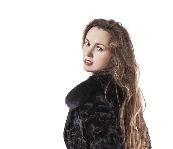 Portrait of young business woman in a black coat on a white background — Stock Photo, Image