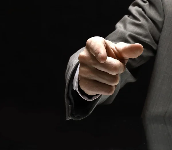 Closeup. businessman pointing at a copy space while sitting at — Stock Photo, Image