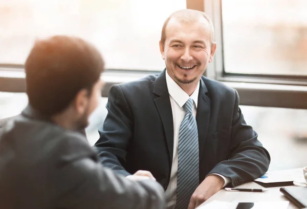 Business people shaking hands, finishing up a meeting, in the office — Stock Photo, Image