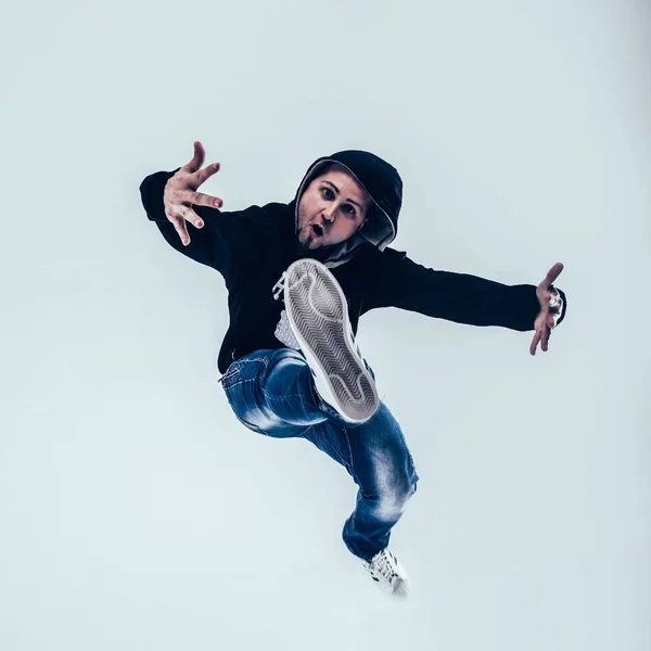 stylish rapper is dancing breakdance .photo on a white backgroun