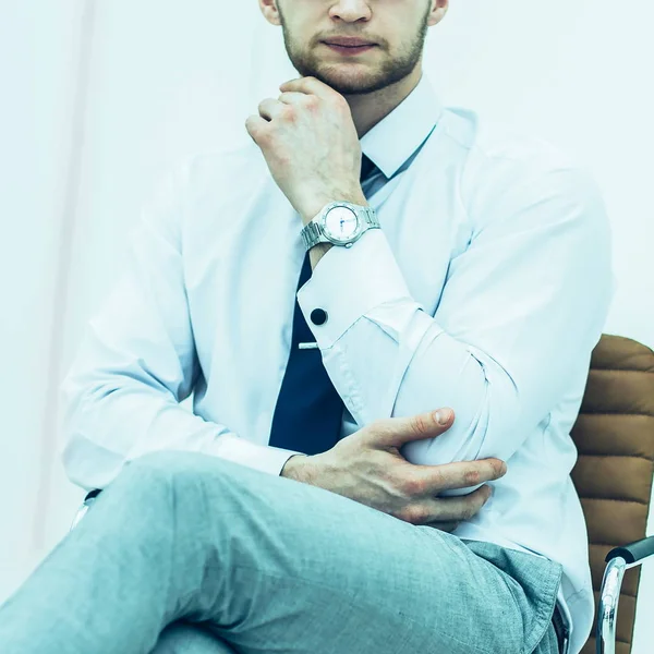 Concept of business success - businessman sitting on a chair in — Stock Photo, Image