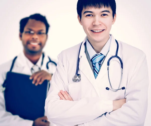 O médico e estagiário em um fundo branco — Fotografia de Stock