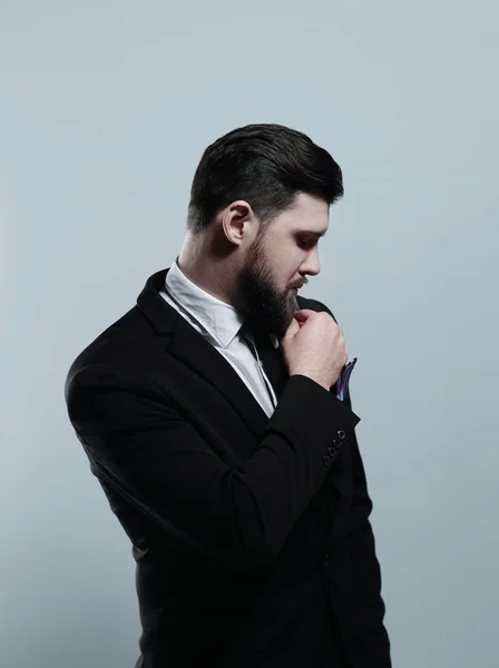 Confidence and charisma. Handsome young man in full suit adjusting his jacket — Stock Photo, Image