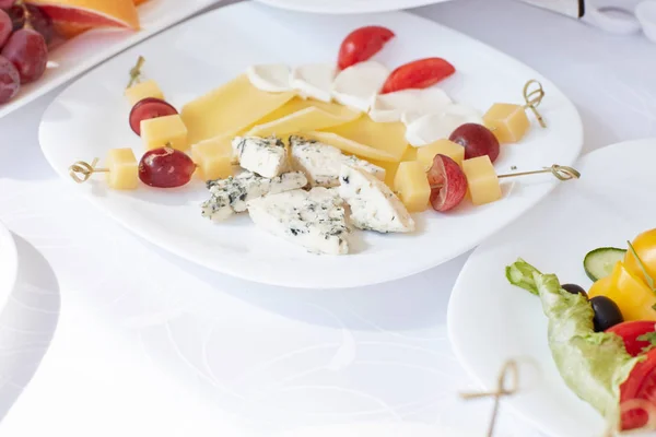 Cheese platter on a plate in the restaurant — Stock Photo, Image