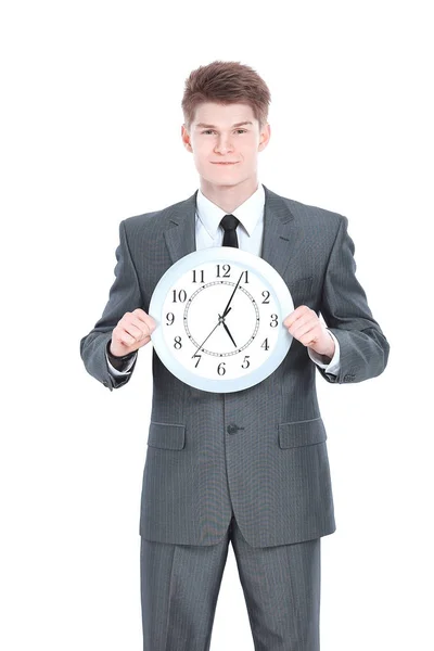 Schöner Geschäftsmann, der eine große Uhr hält. — Stockfoto