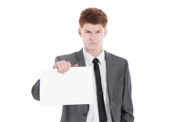 Ung affärsman visar ett tomt lakan isolerad på en vit — Stockfoto