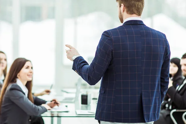 senior Manager of the company holds a working meeting with business team in modern office