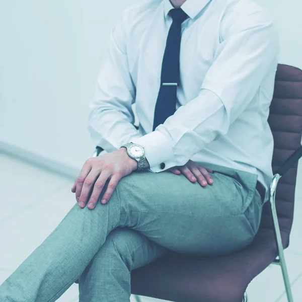 Concept of business success - businessman sitting on a chair in — Stock Photo, Image