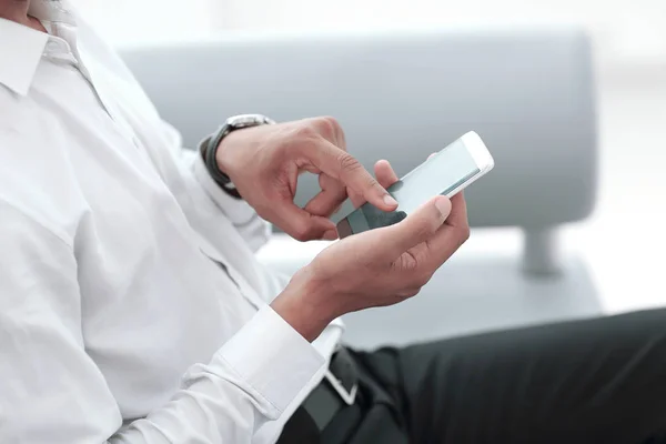 Close up. modern man typing on his smartphone. — Stock Photo, Image