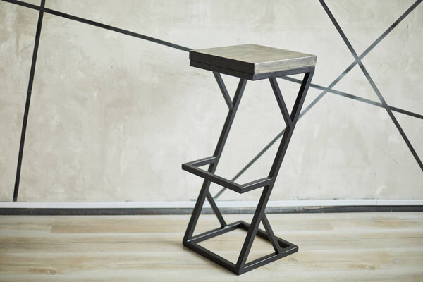 bar stool made of wood and metal.