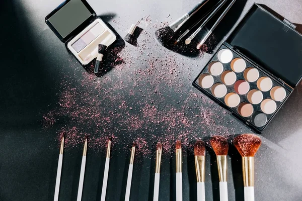 professional makeup set isolated on black background