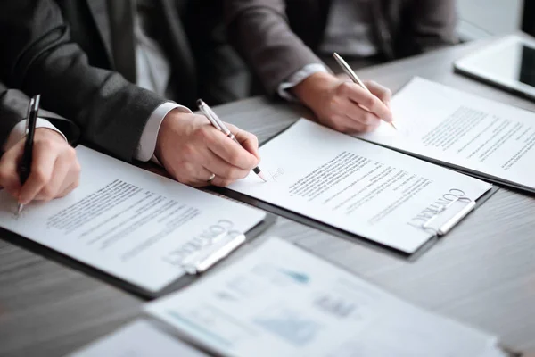 Close up. business partners sign a new contract — Stock Photo, Image