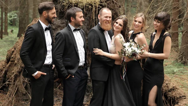 friends congratulate the bride and groom with the wedding