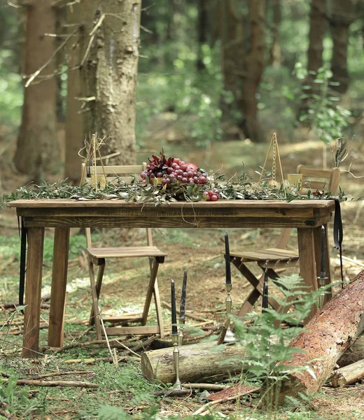table for a festive picnic in the woods.holiday concept