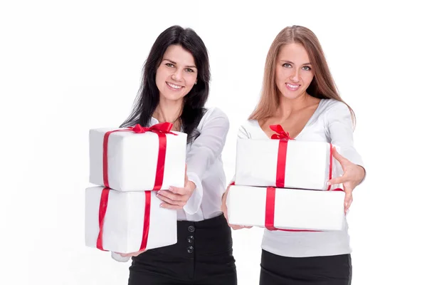 Two young women with gift boxes. isolated on white — Stock Photo, Image