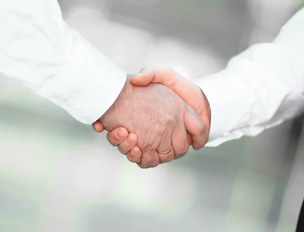 Closeup. handshake of business partners on blurred background. — Stock Photo, Image