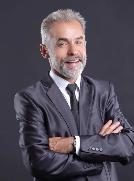 Retrato de un hombre de negocios senior. Aislado sobre fondo oscuro — Foto de Stock