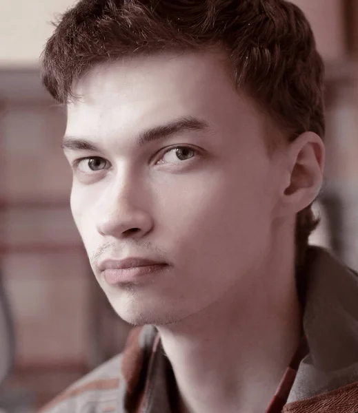 Close up. young guy looking at camera — Stock Photo, Image