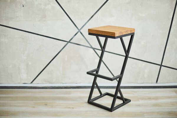 bar stool made of wood and metal.