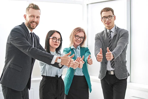 Professional employees of the company showing thumbs up. — Stock Photo, Image