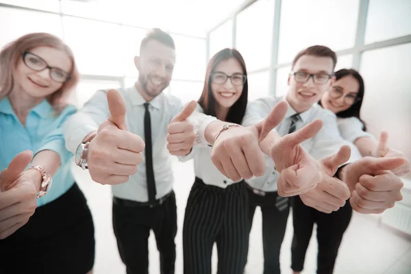 Close up. business team showing their thumbs up — Stock Photo, Image