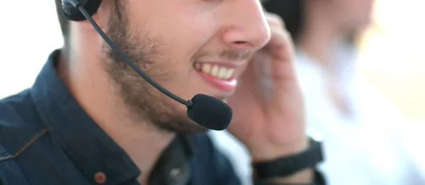 close up. smiling call center operator looking at the computer m