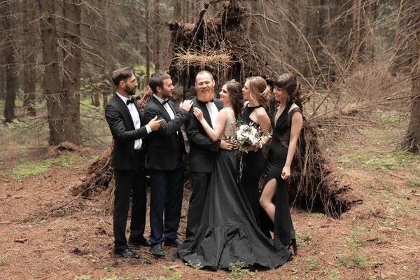 friends congratulate the bride and groom with the wedding