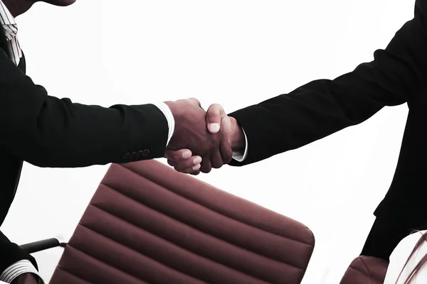 Closeup .the handshake between colleagues in the workplace — Stock Photo, Image